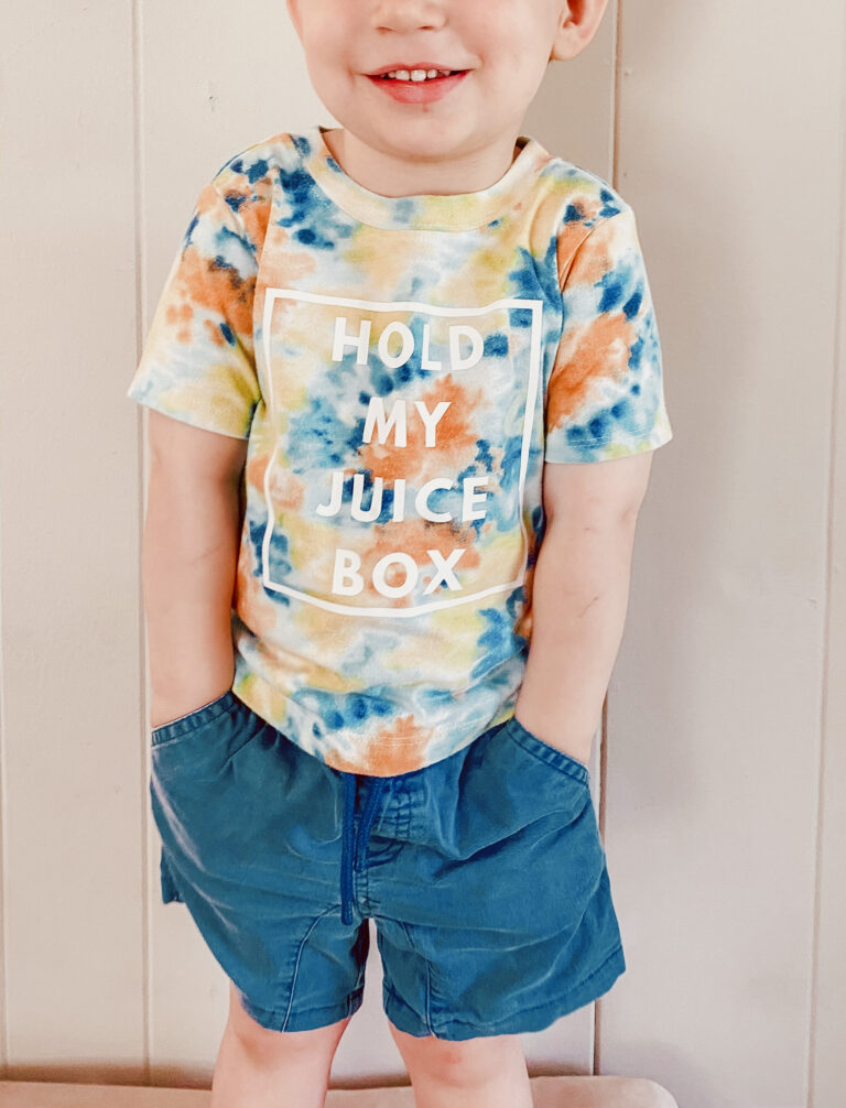 Toddler wearing a Tie Dyed T-Shirt with Custom Design Made in Canva for Cricut or Silhouette Cut File