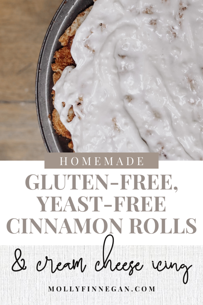 homemade gluten free yeast free cinnamon rolls iced on a wooden table