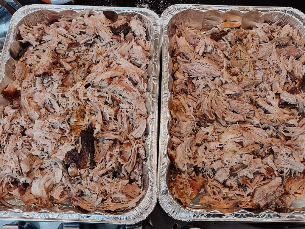 Two 9x13 pans of roasted pork shoulder